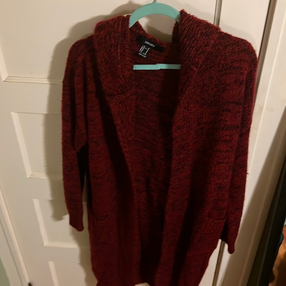 Medium, duster cardigan with hood and deep pockets.